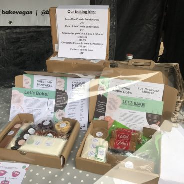 Images of vegan baking kit contents on a market stall.